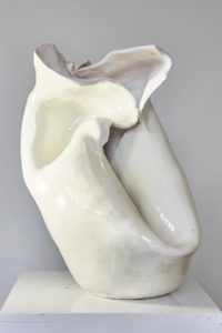 A white, curvaceous ceramic sculpture
