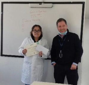 Tom Caston, MPW Cambridge Principal, presenting Hau Yi (Rachel) Lam with first prize in the Science Challenge
